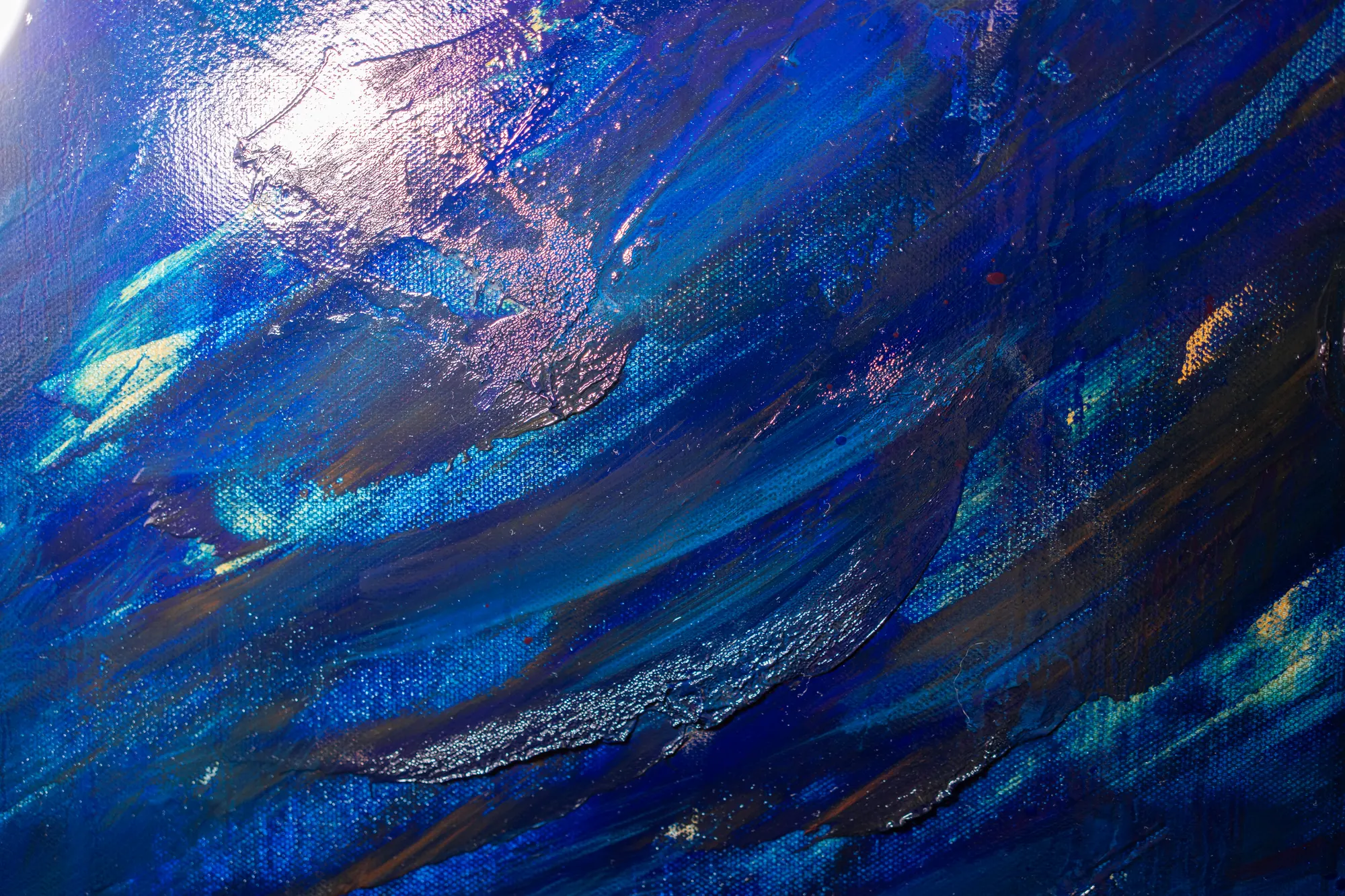 Close view of the calmer upper left, smooth blue strokes over visible canvas weave with a bright highlight at the top.