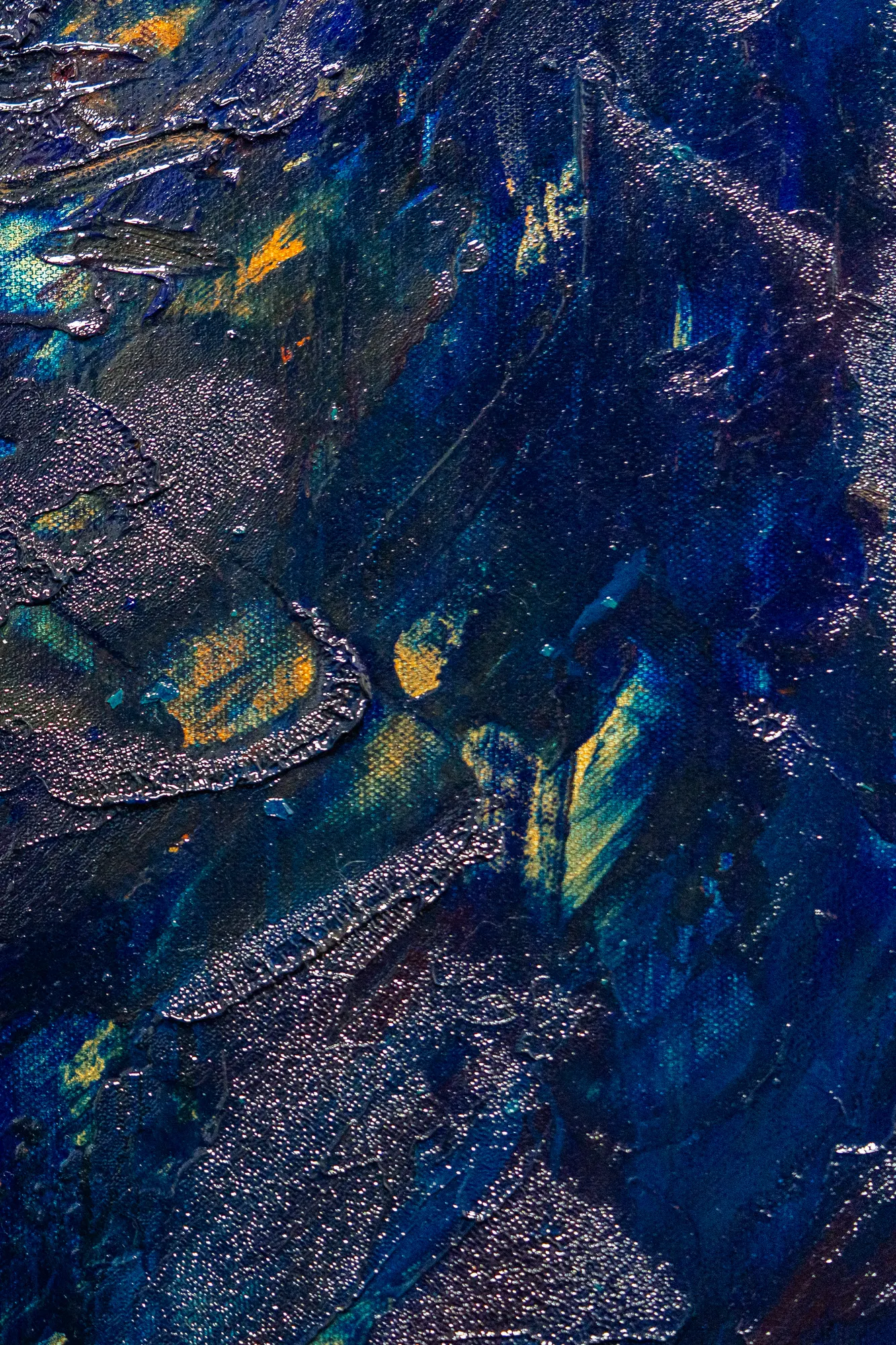 A tall slice through the crusted silver diagonal, orange flecks surfacing between the ridges.