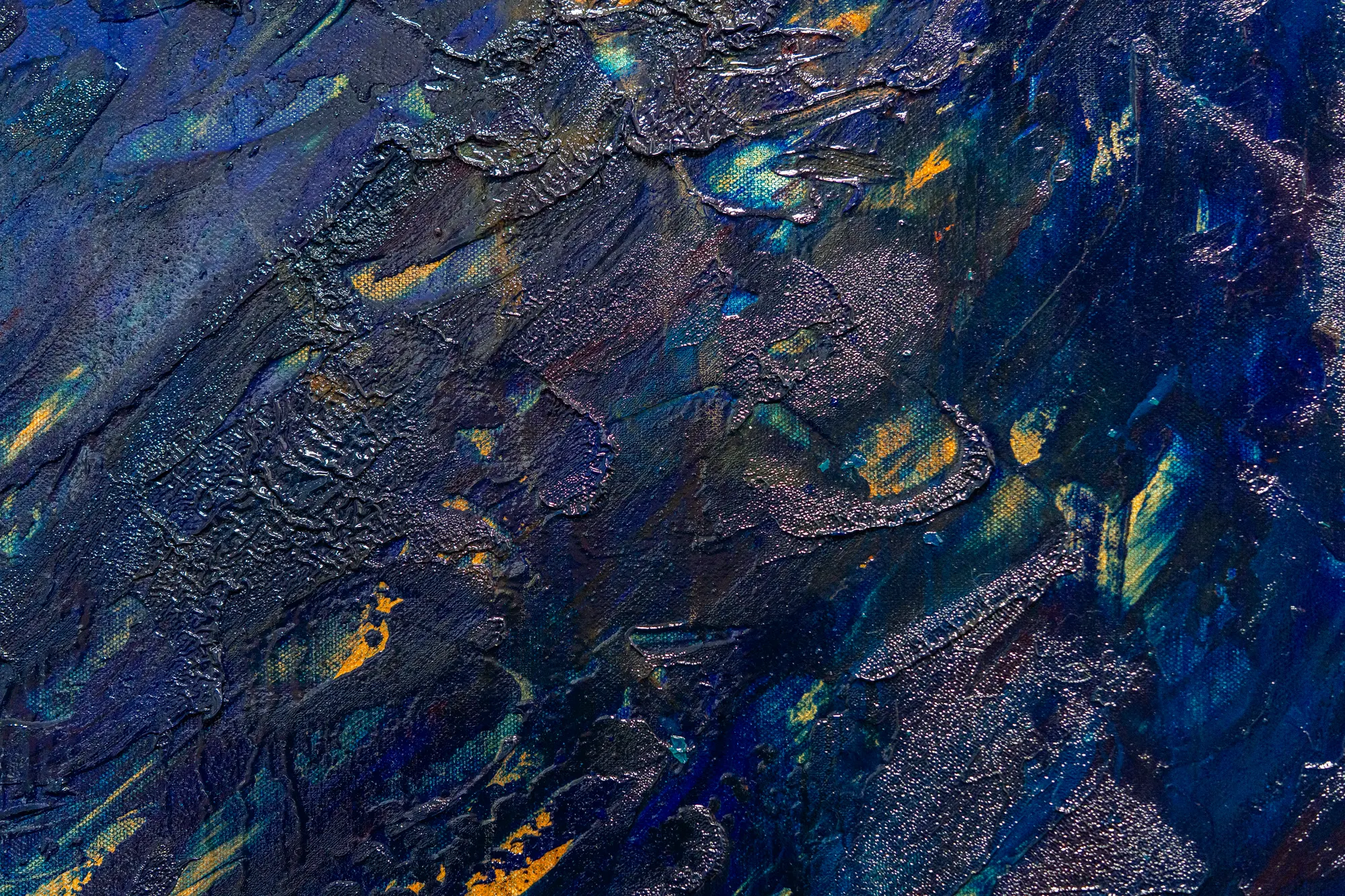 Close view of the textured diagonal, where crusted silver ridges sit over blue and small orange flecks show through the weave.