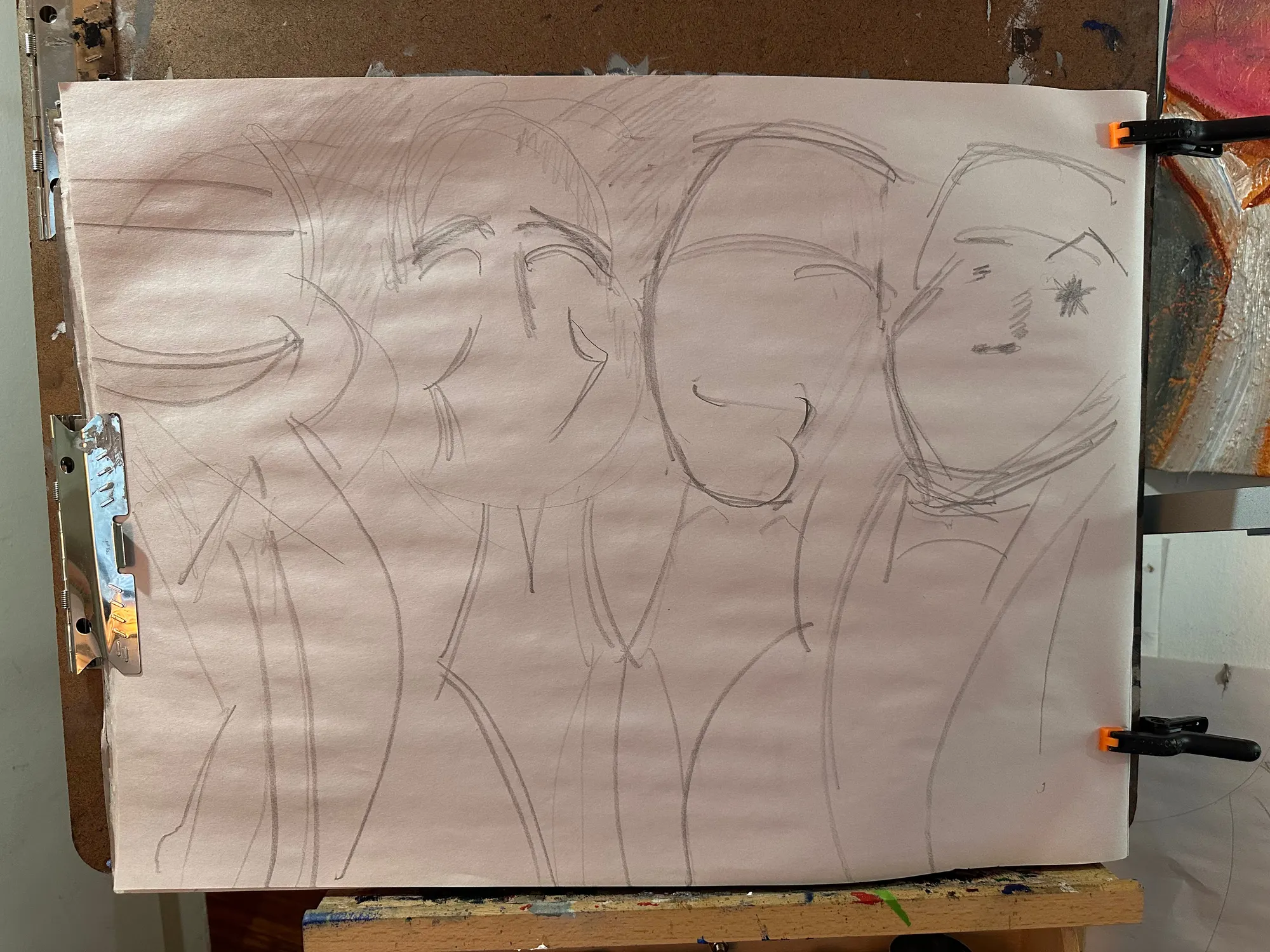 A pencil sketch on newsprint of four figures with their arms around each other, heads drawn as plain ovals with almost no features.