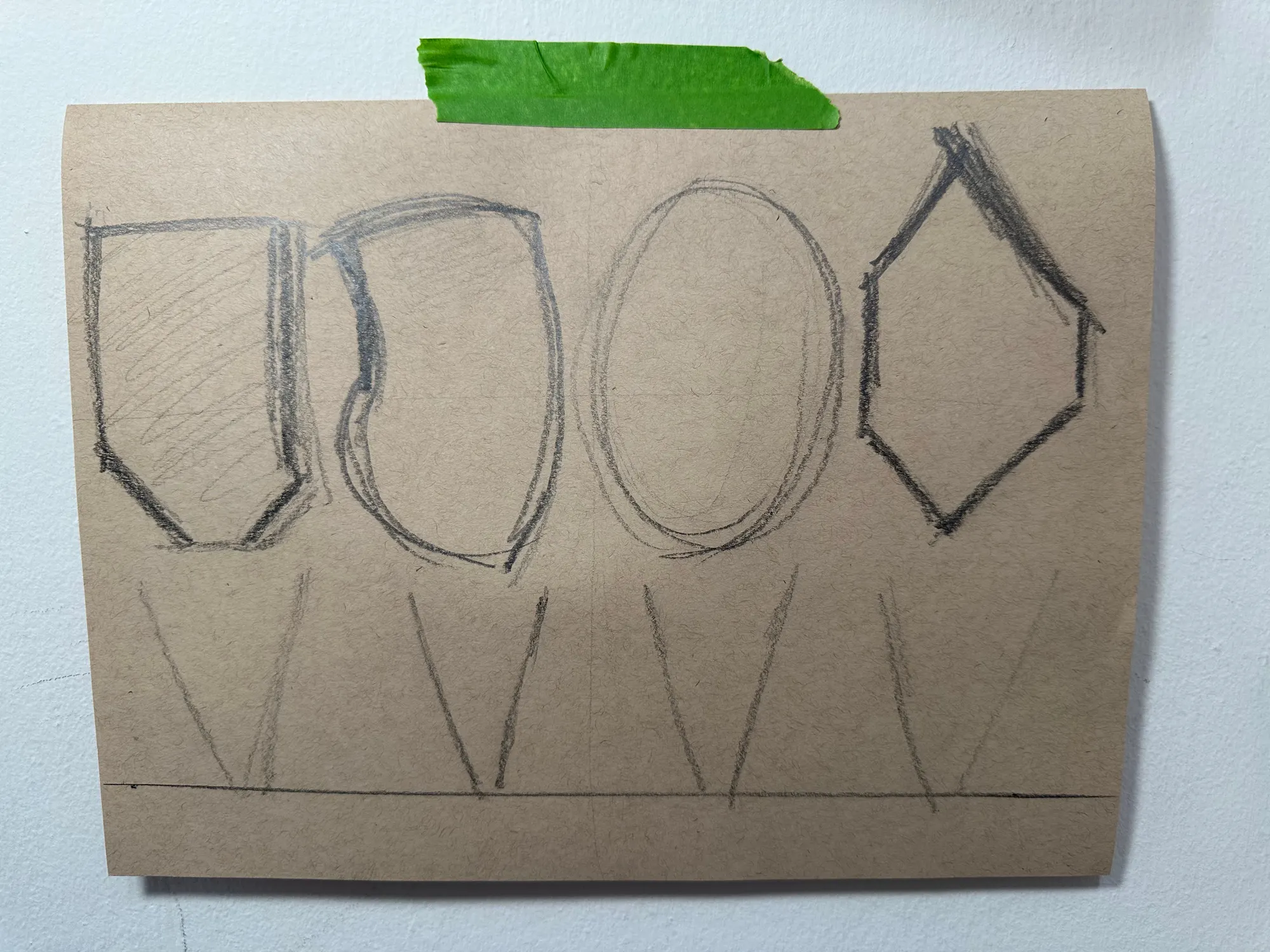 A cleaner Display Room iteration on toned paper: a shield form, a rounded square, an oval and a diamond, each on its own stand along a baseline.